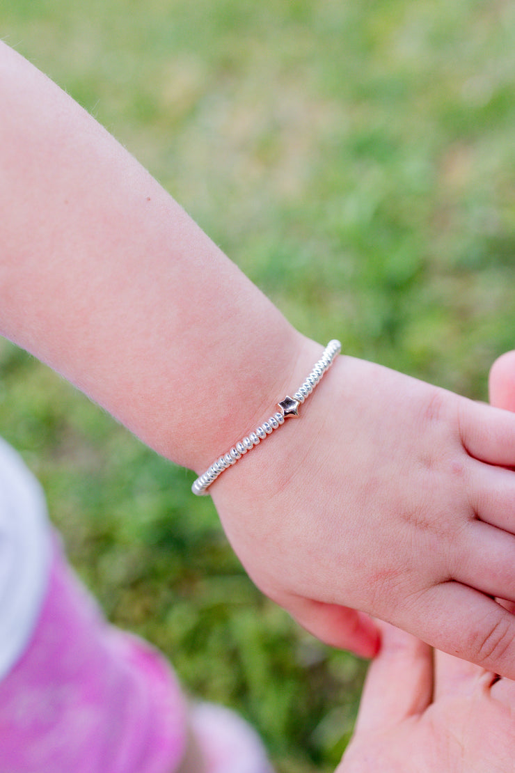 Bracciale rondelle e stellina - modello bambina