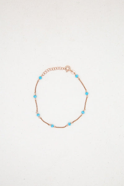Bracciale oro rosa perline azzurre